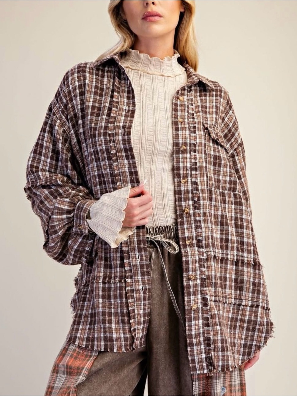 Oversized brown plaid button-down flannel by the brand Easel